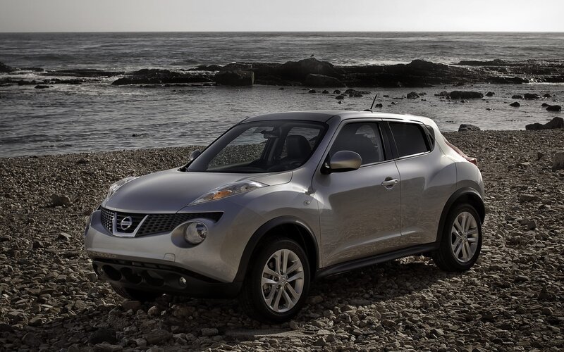 Silver Nissan Juke on a rocky beach