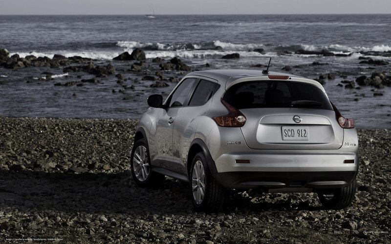 Silver Nissan Juke on rocky beach