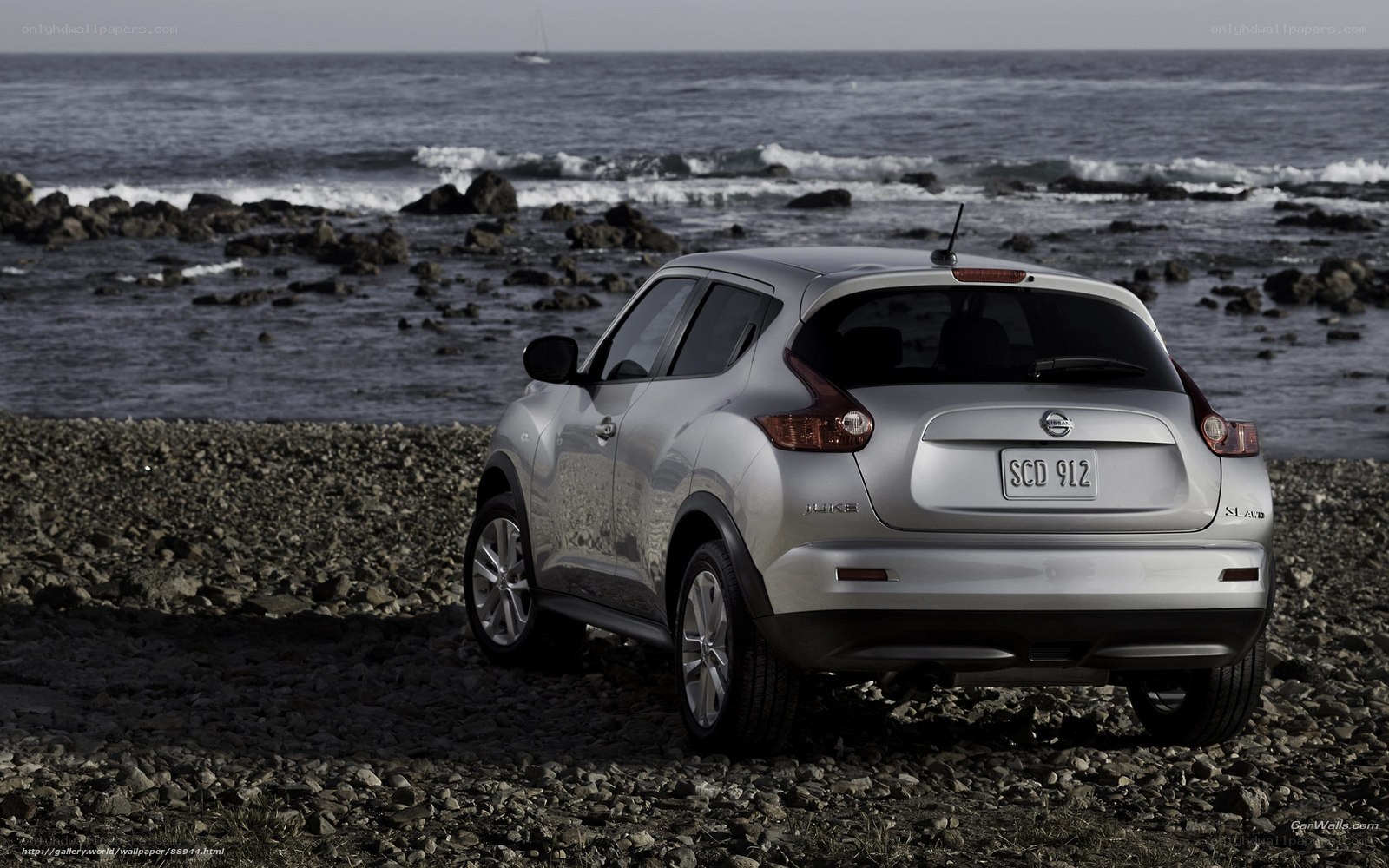Silver Nissan Juke on rocky beach