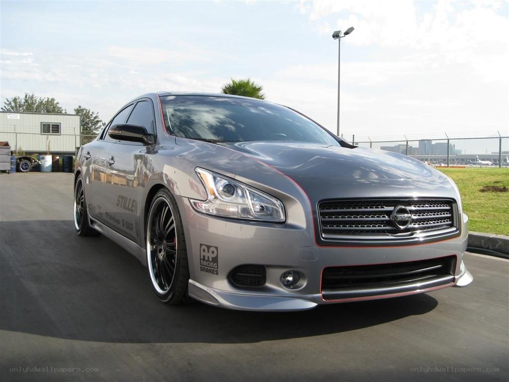 silver nissan maxima with custom wheels