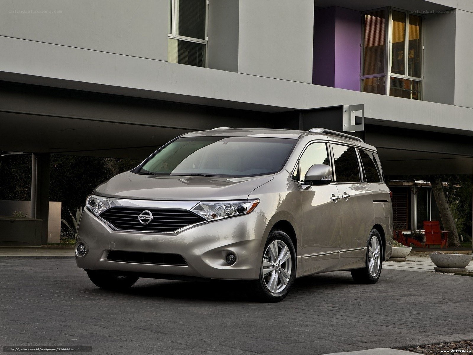 Silver Nissan minivan parked