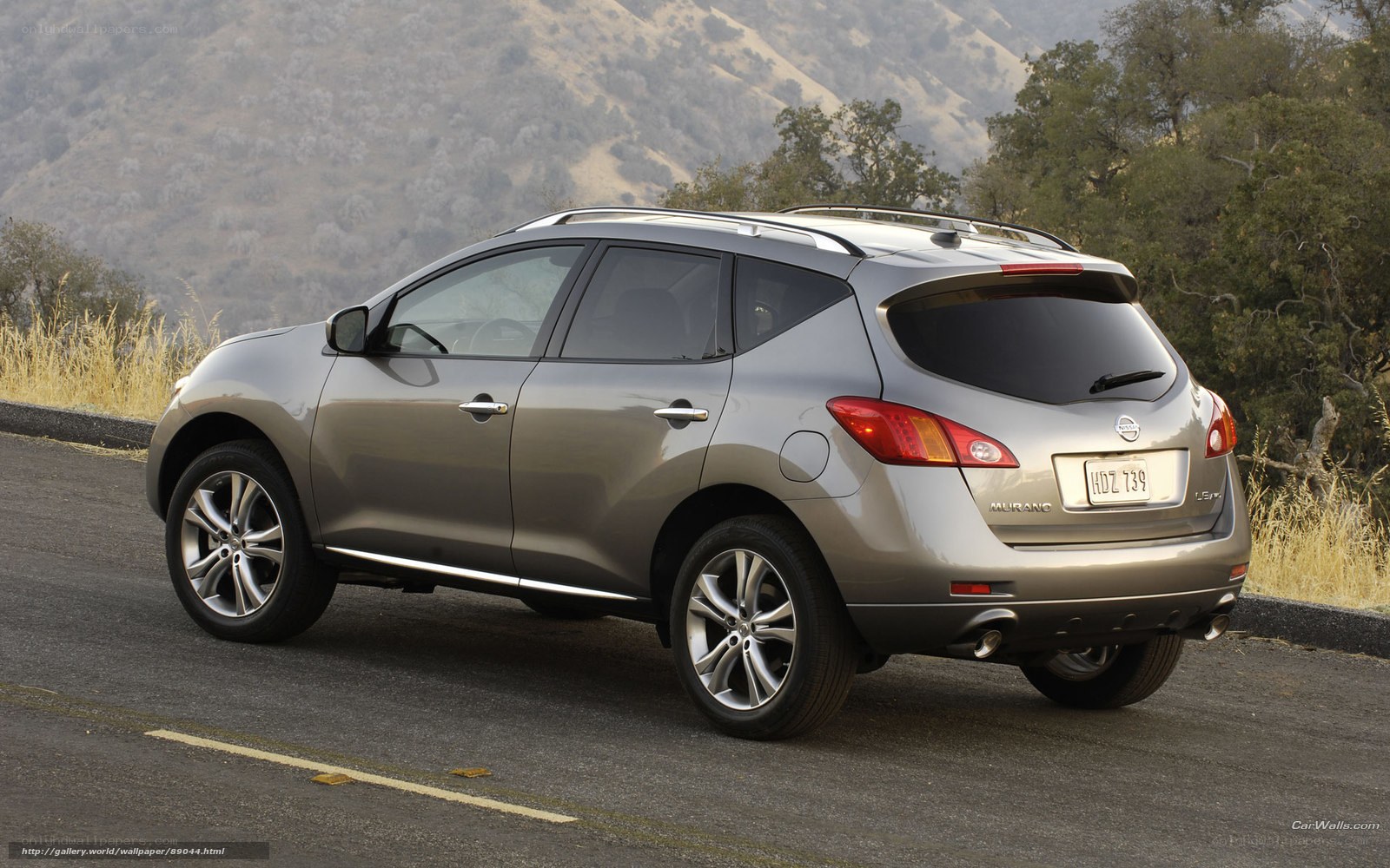 silver nissan murano on mountain road