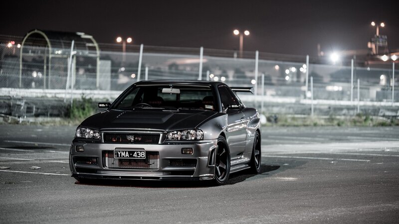 silver nissan skyline at night