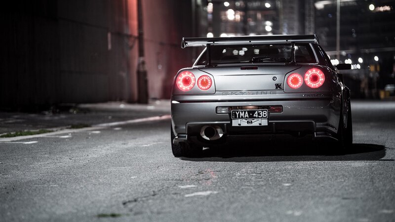 Silver Nissan Skyline at night