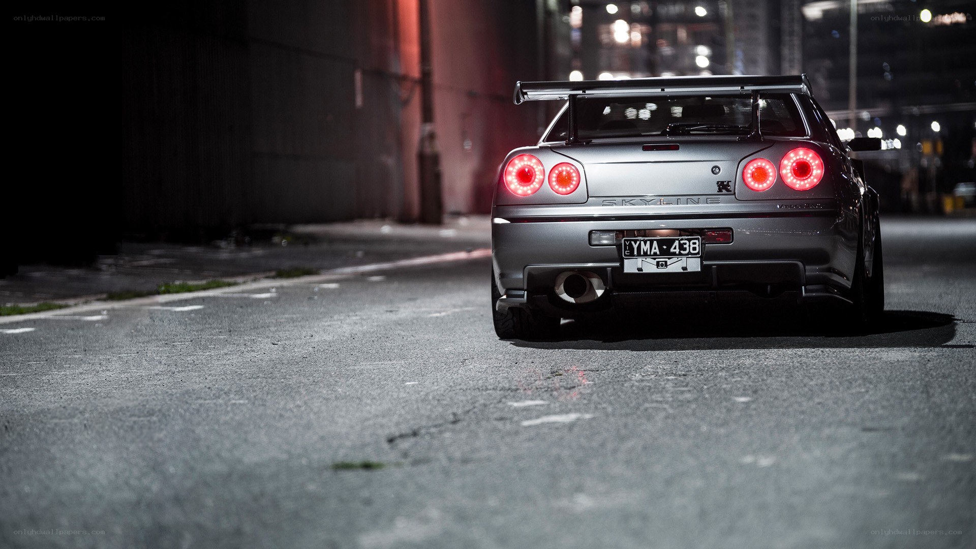 silver nissan skyline at night
