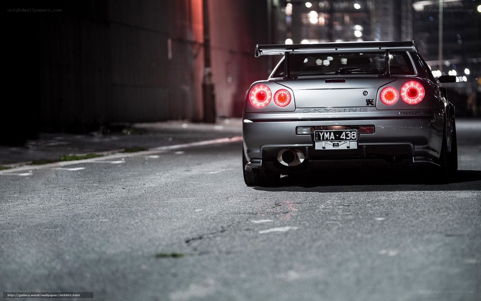 silver nissan skyline at night