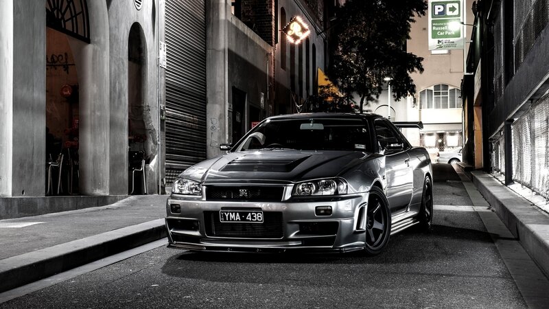 silver nissan skyline in alley
