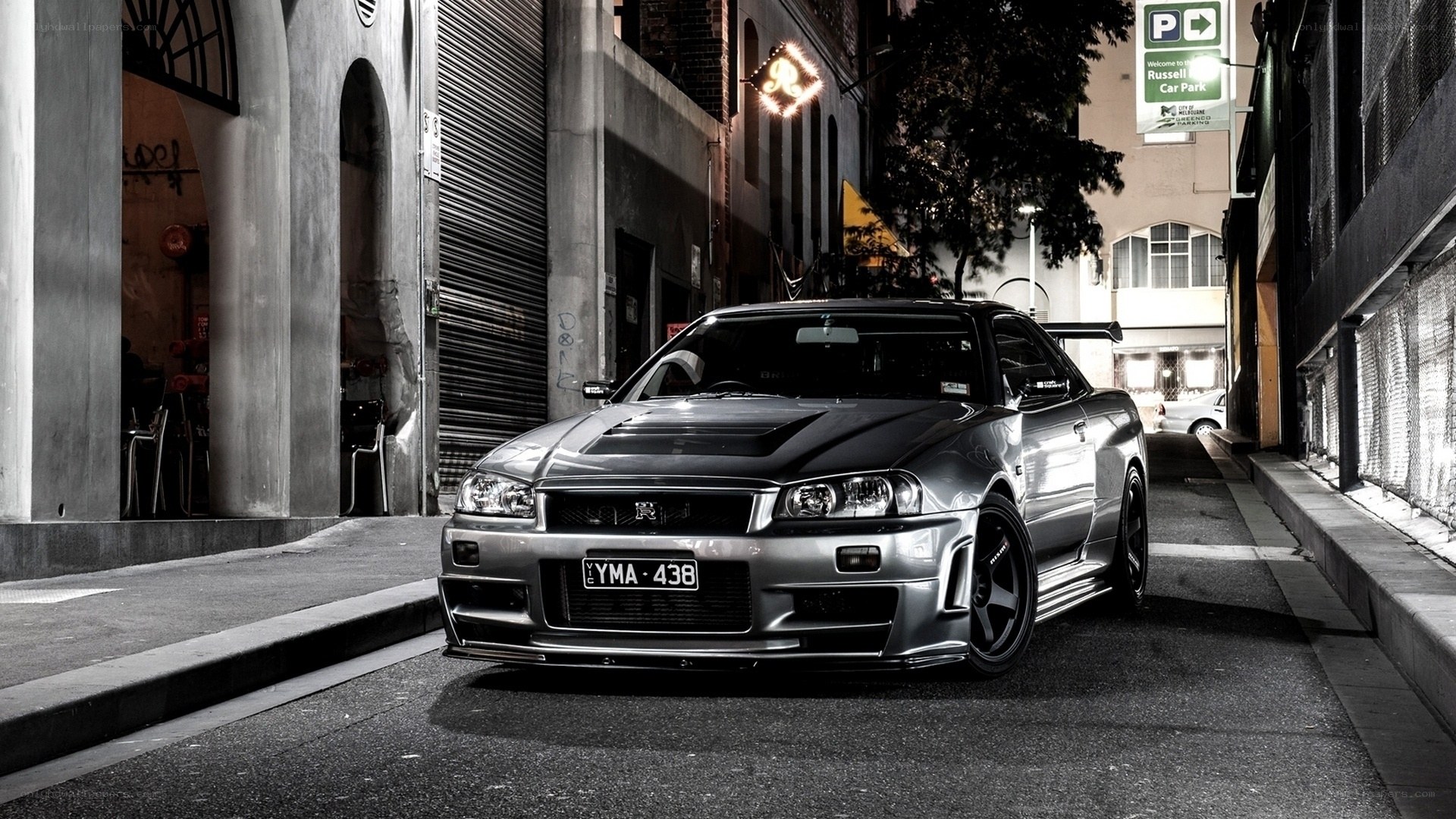 silver nissan skyline in alley