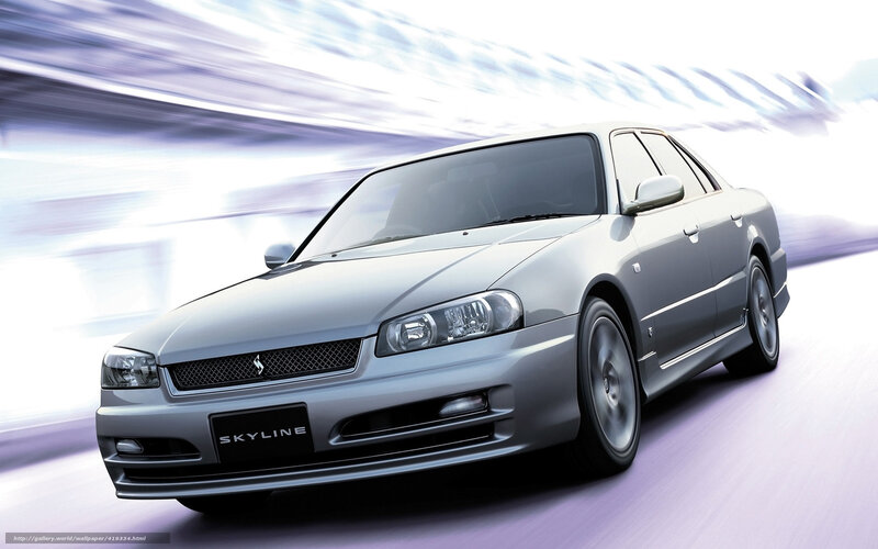 Silver Nissan Skyline in motion
