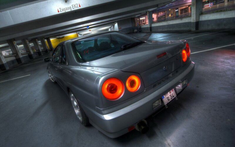 silver nissan skyline in parking garage