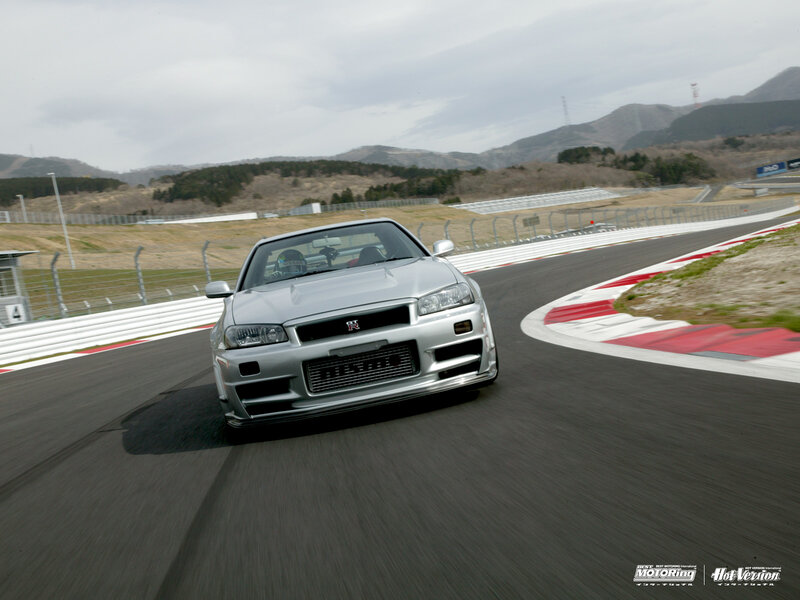 silver nissan skyline on racetrack