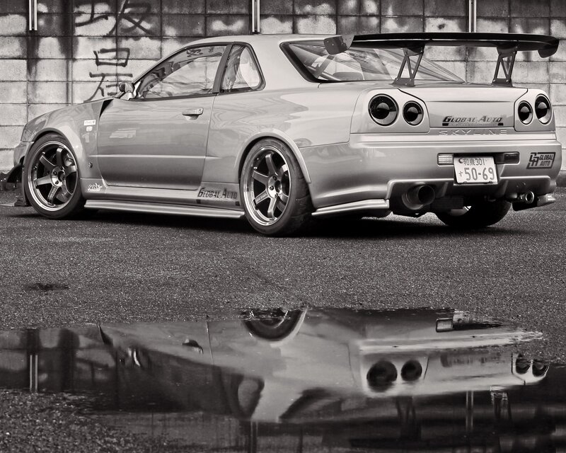 Silver Nissan Skyline with rear spoiler