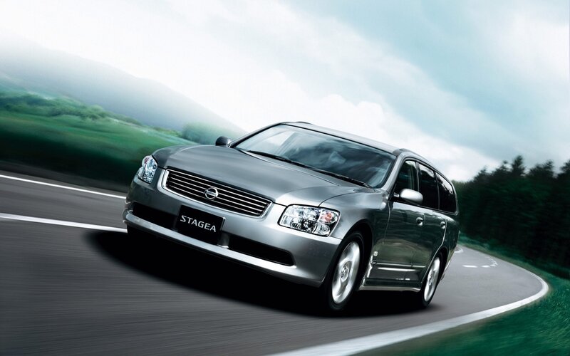 Silver Nissan Stagea on a winding road