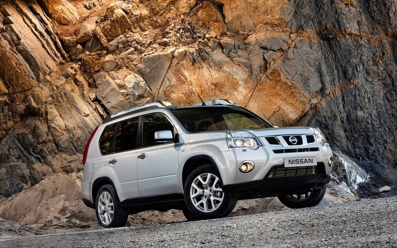Silver Nissan X-Trail on rocky terrain