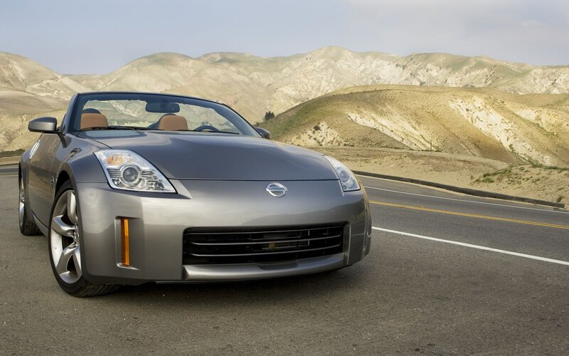 Silver Nissan Z convertible on road