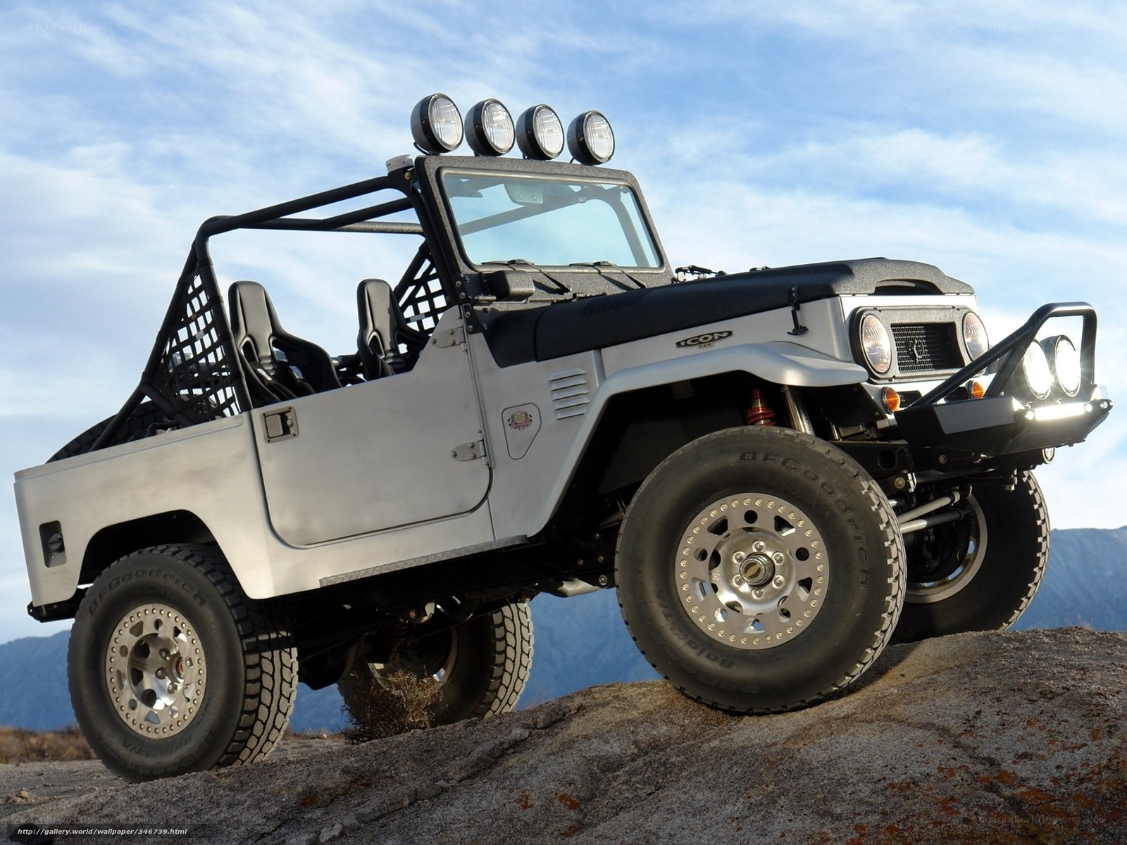 Silver off-road vehicle on rock