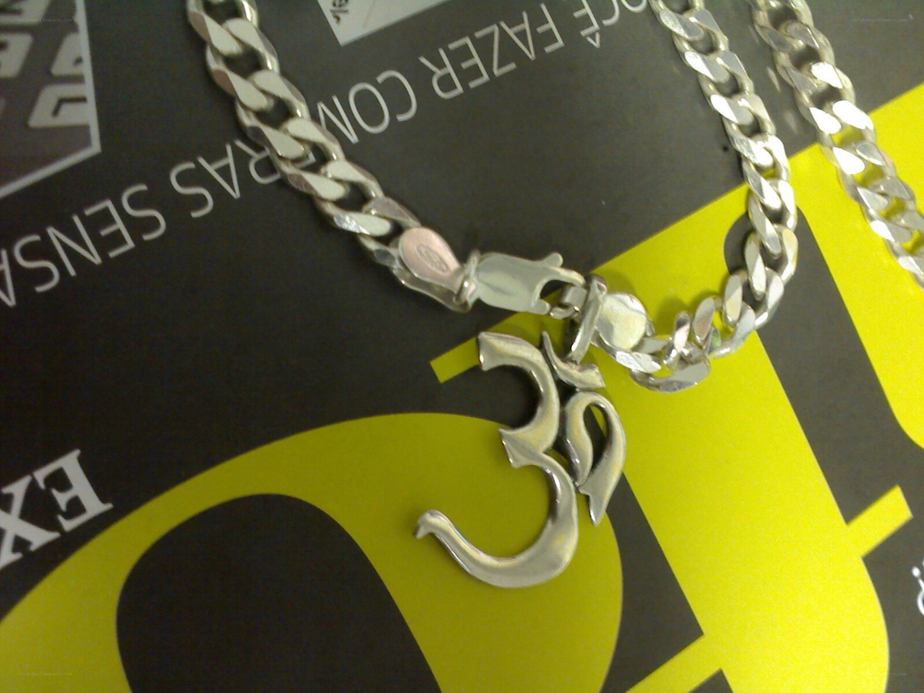 silver om pendant necklace