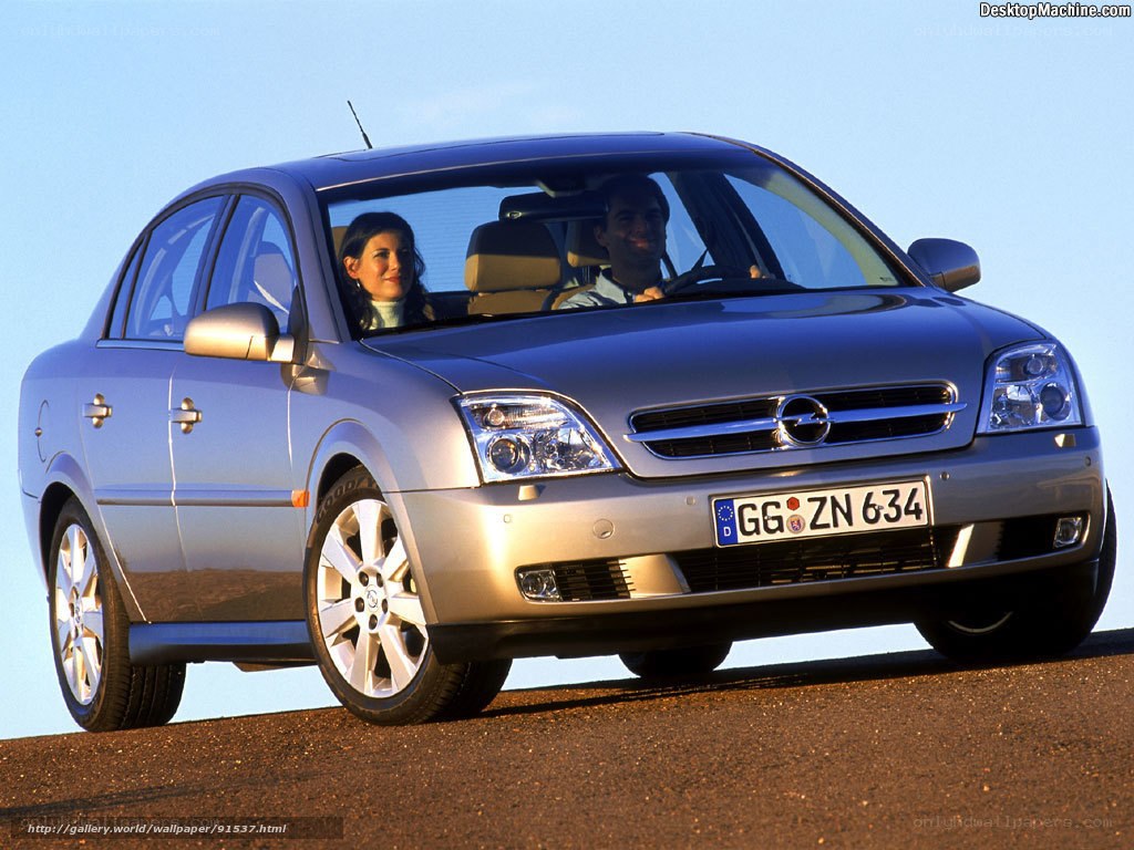 silver opel in motion