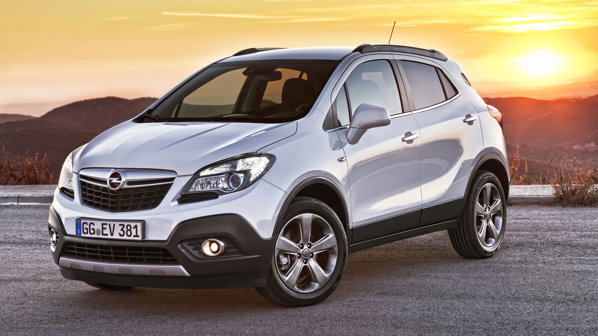 silver opel mokka at sunset
