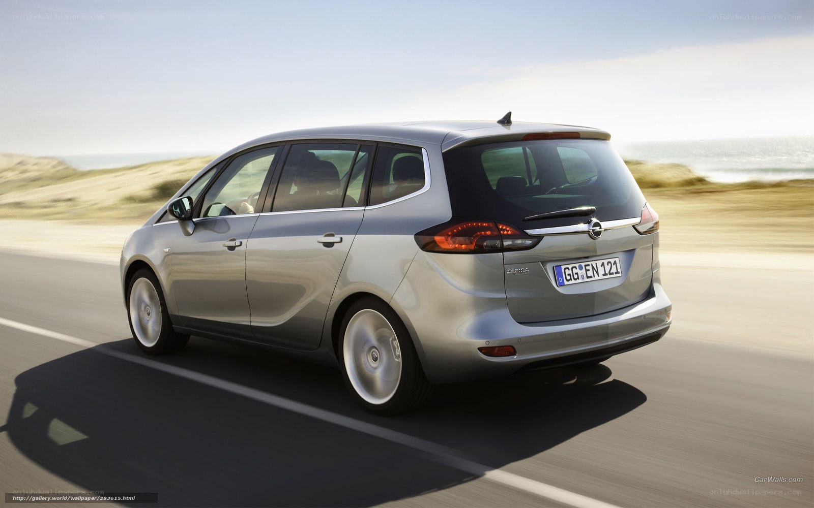 silver opel zafira driving on coast