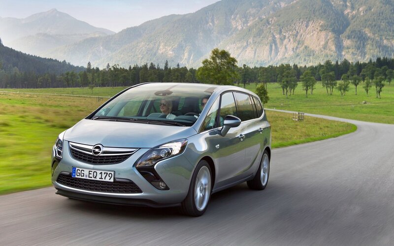 silver opel zafira driving on road