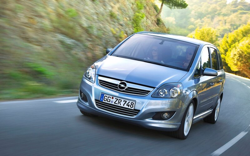 silver opel zafira driving on road