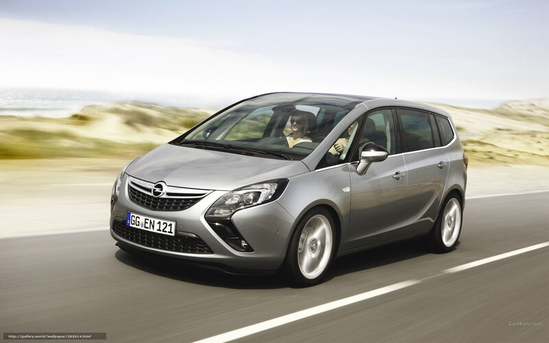 silver opel zafira driving on road