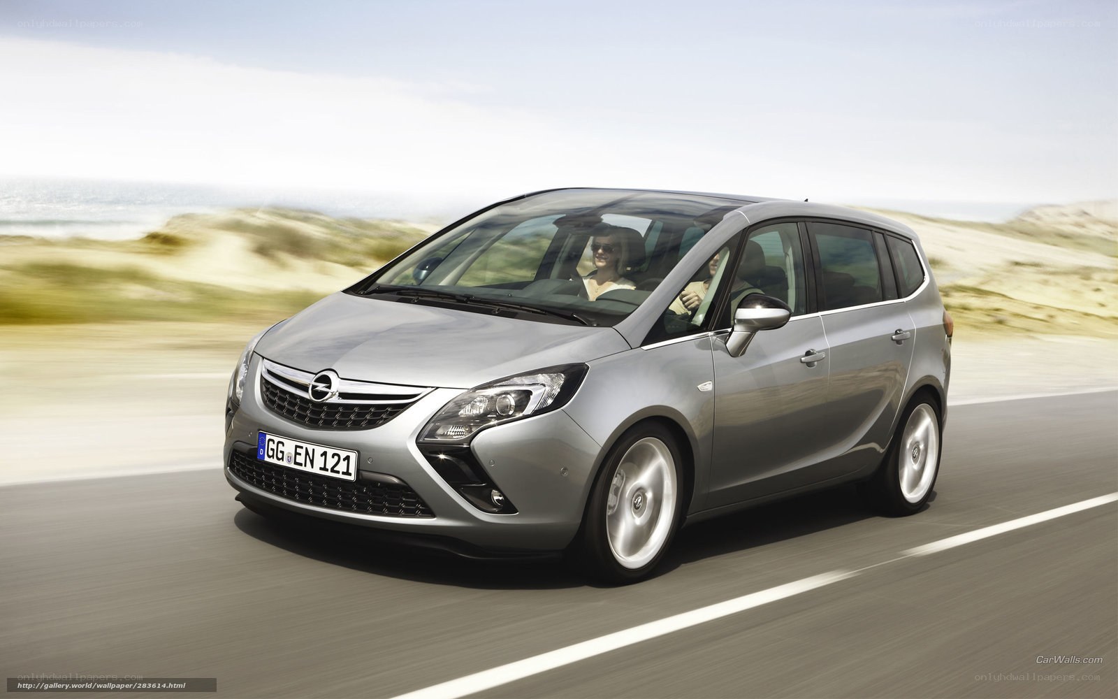 silver opel zafira driving on road