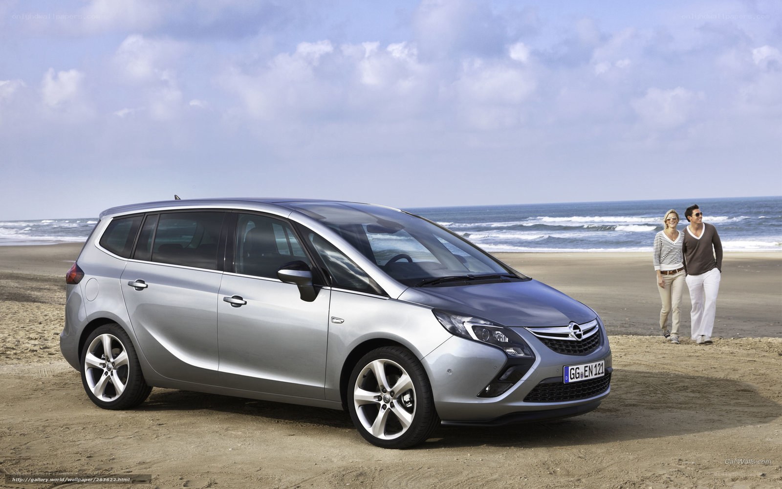 Silver Opel Zafira on beach
