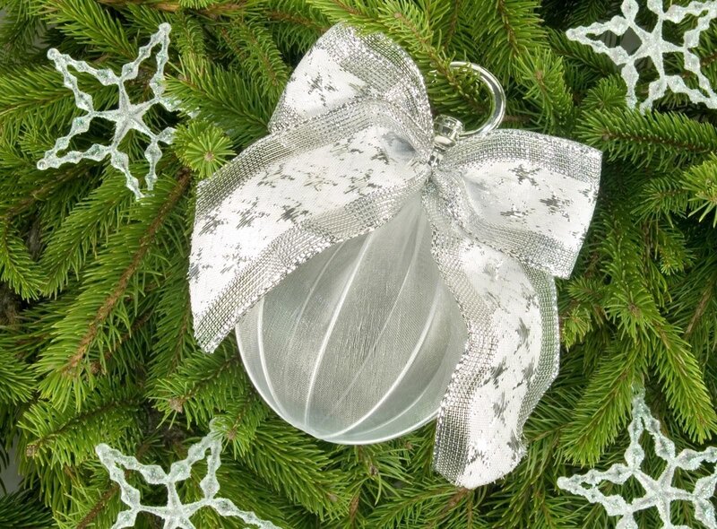 Silver ornament on pine branches