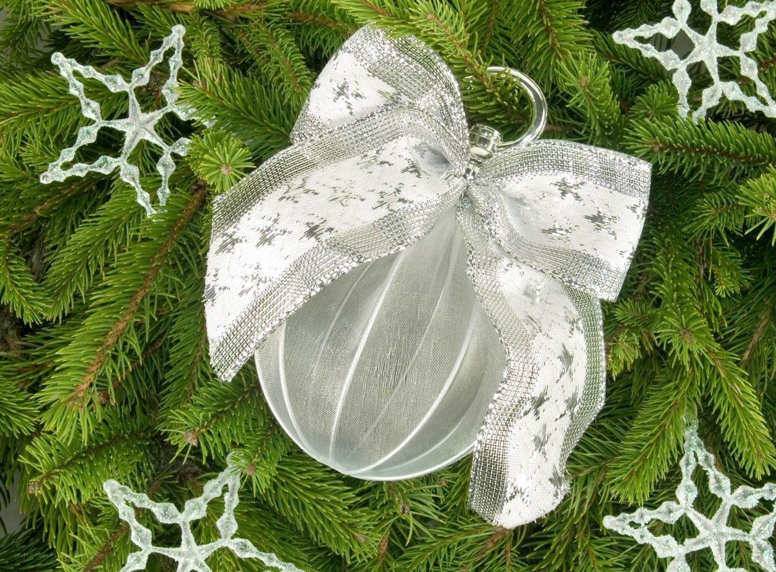 Silver ornament on pine branches