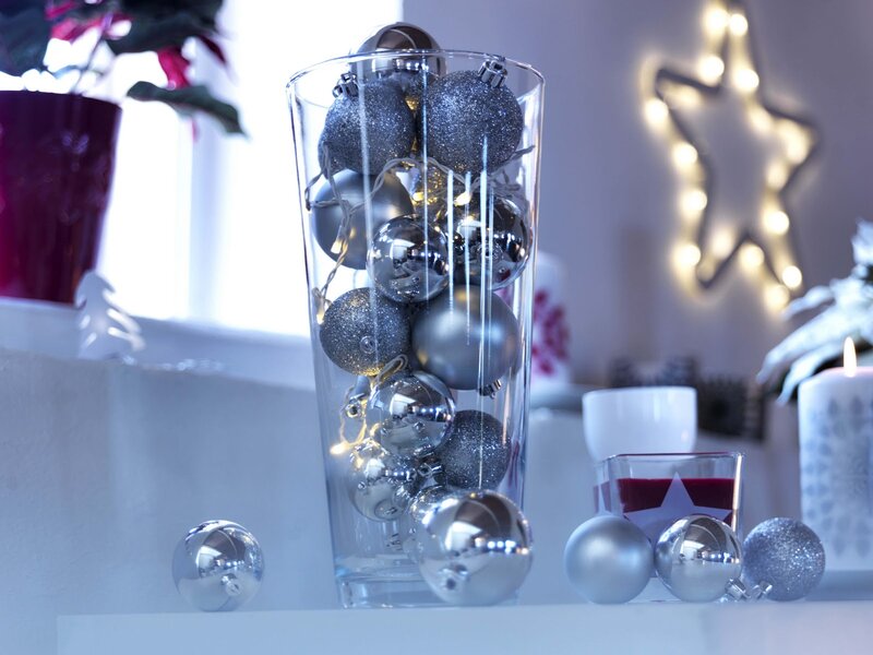 Silver Ornaments in Glass Vase