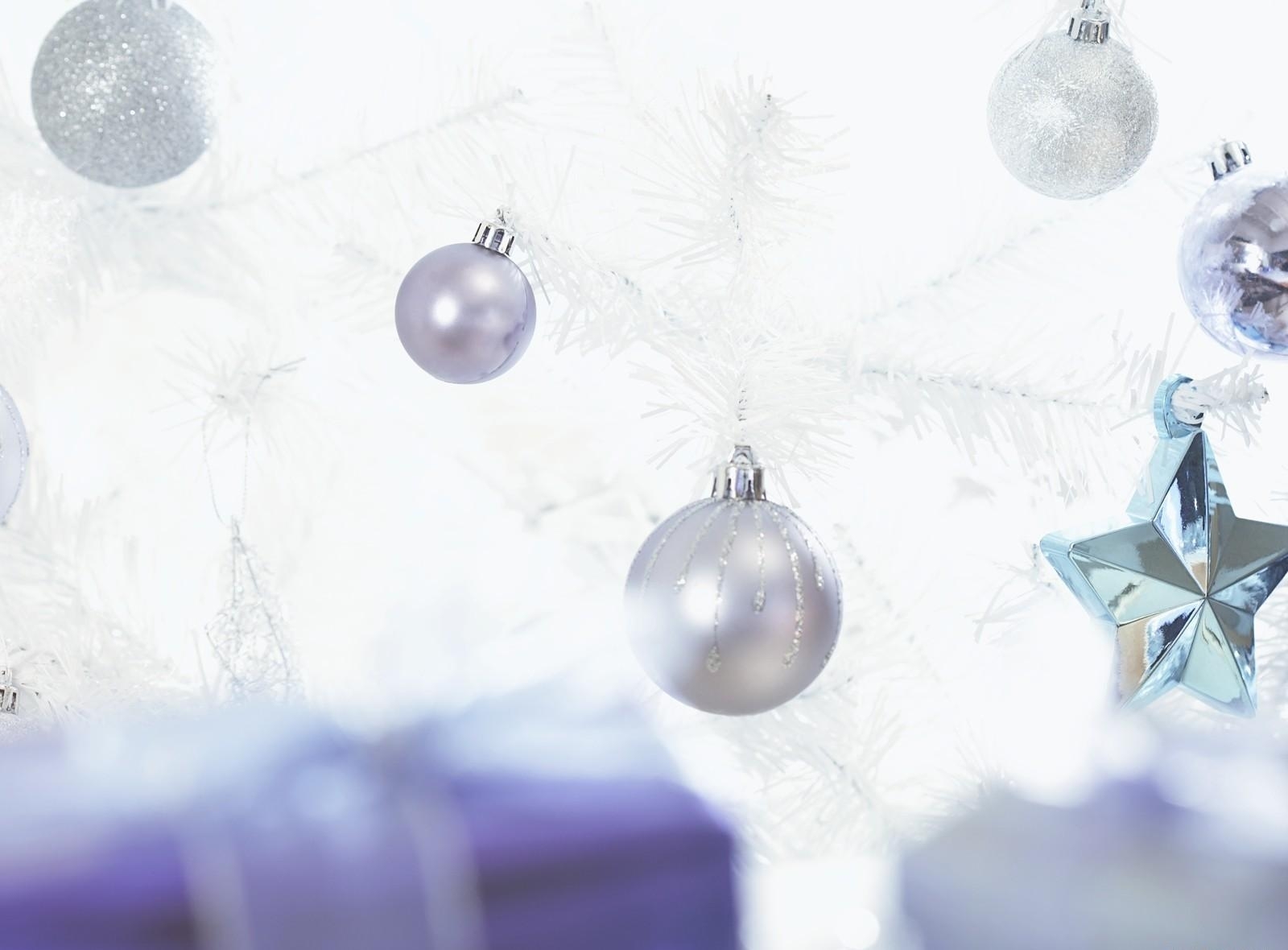 silver ornaments on white tree
