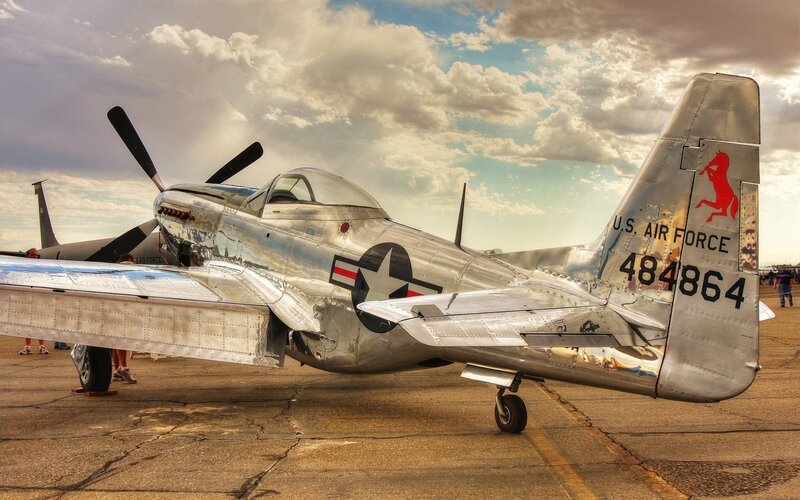 Silver P-51 Mustang on tarmac