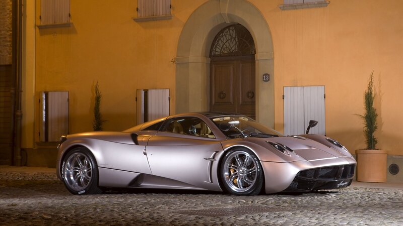 silver Pagani Huayra parked at night