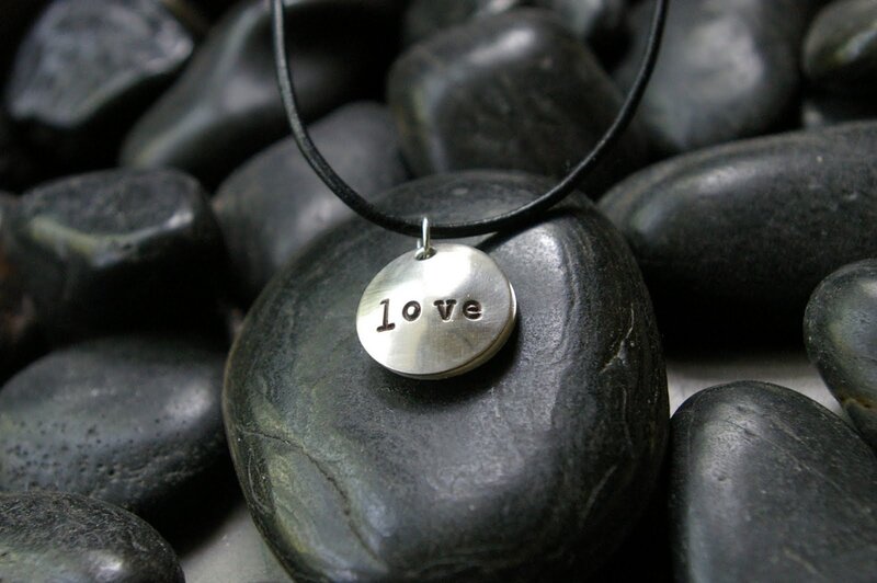 Silver Pendant on Black Cord
