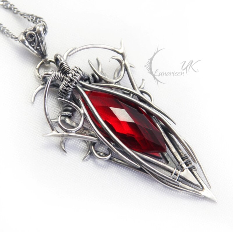 Silver Pendant with Red Gem — Dramatic