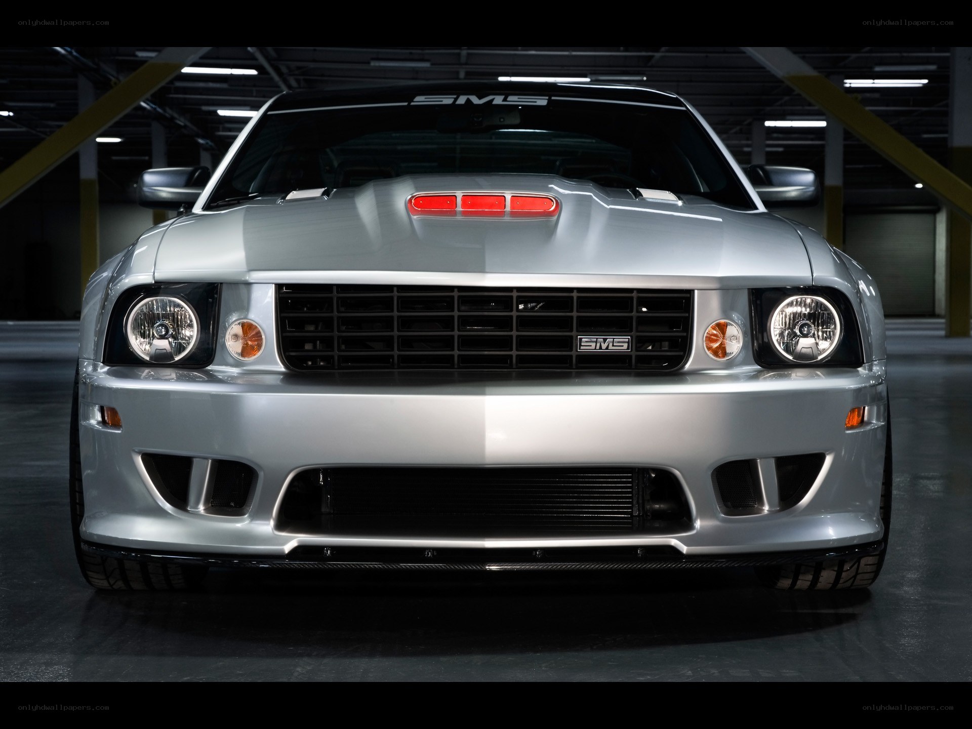 silver performance car front view