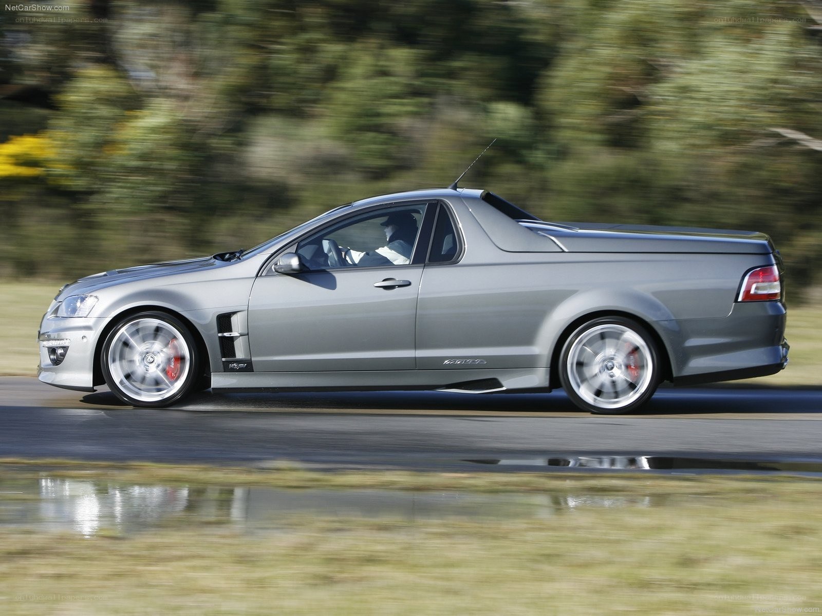 silver performance pickup in motion