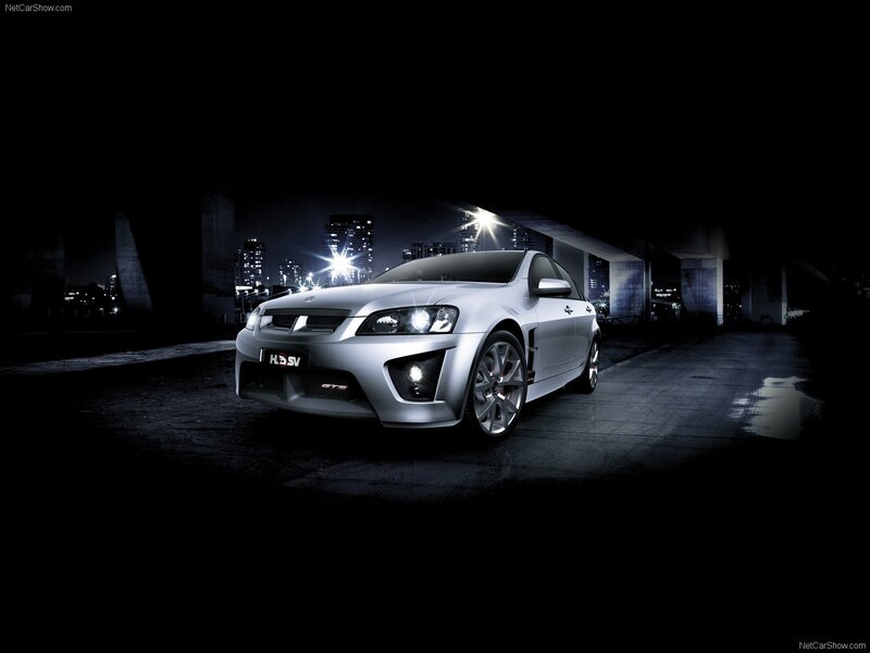 silver performance sedan at night