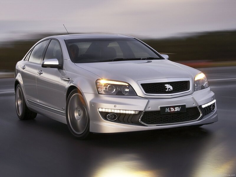 silver performance sedan in motion