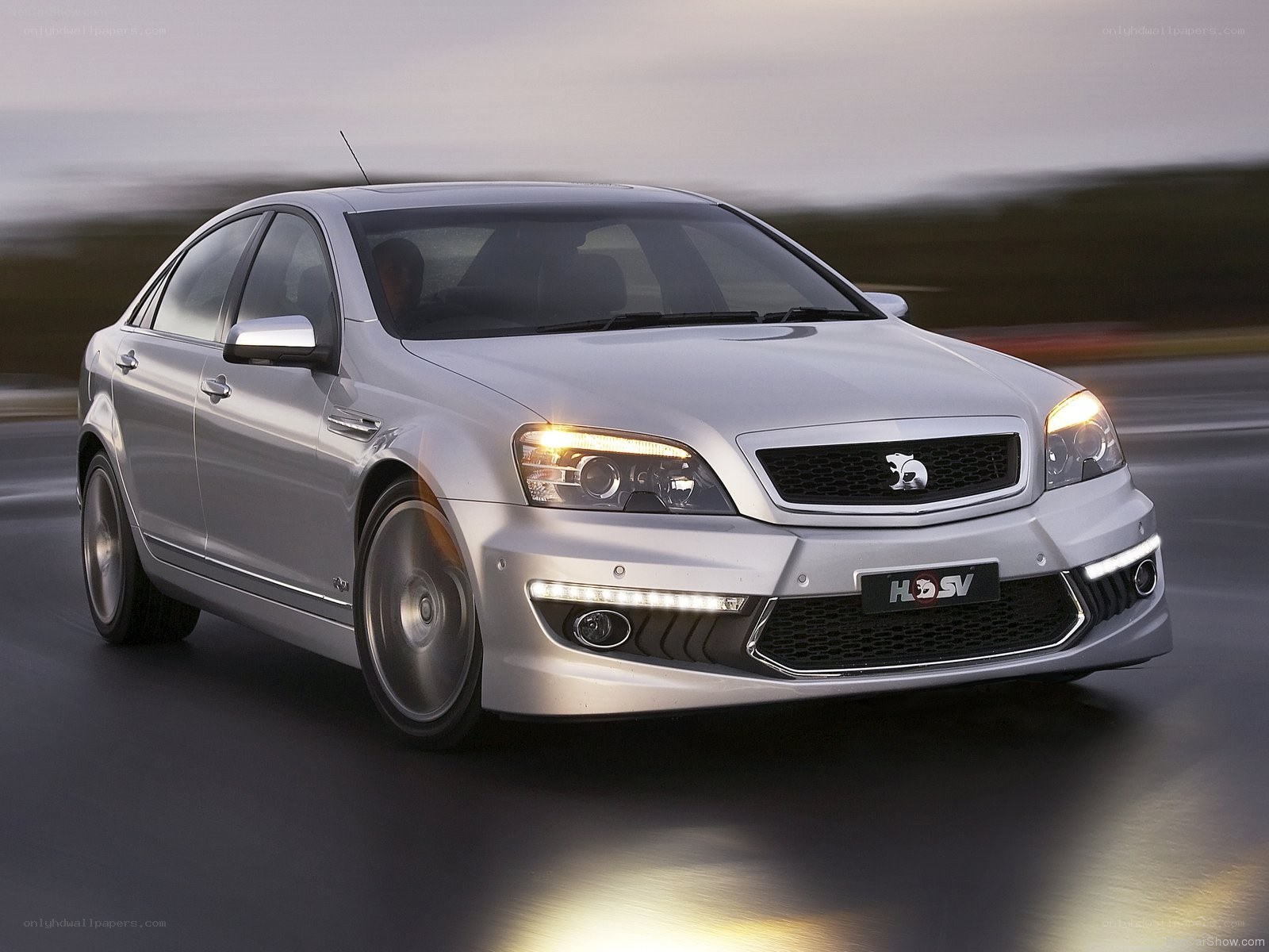silver performance sedan in motion