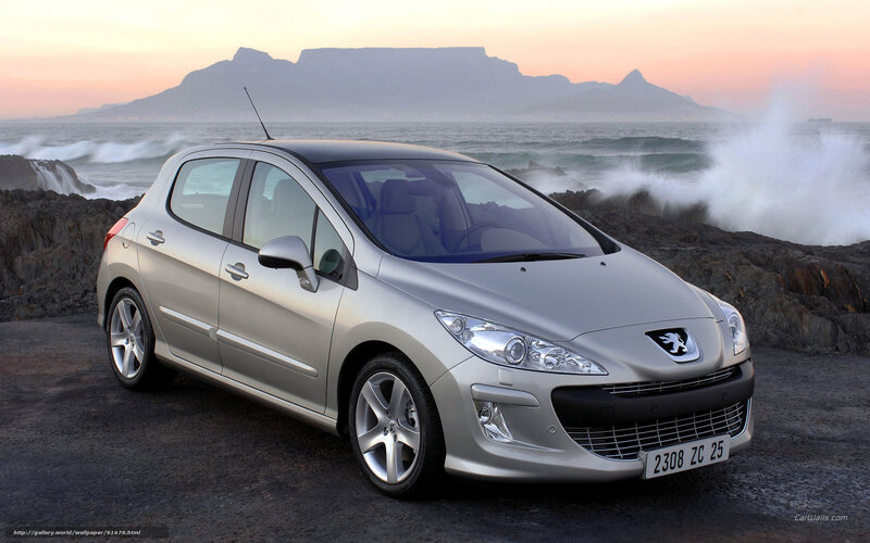 Silver Peugeot 308 by the coast
