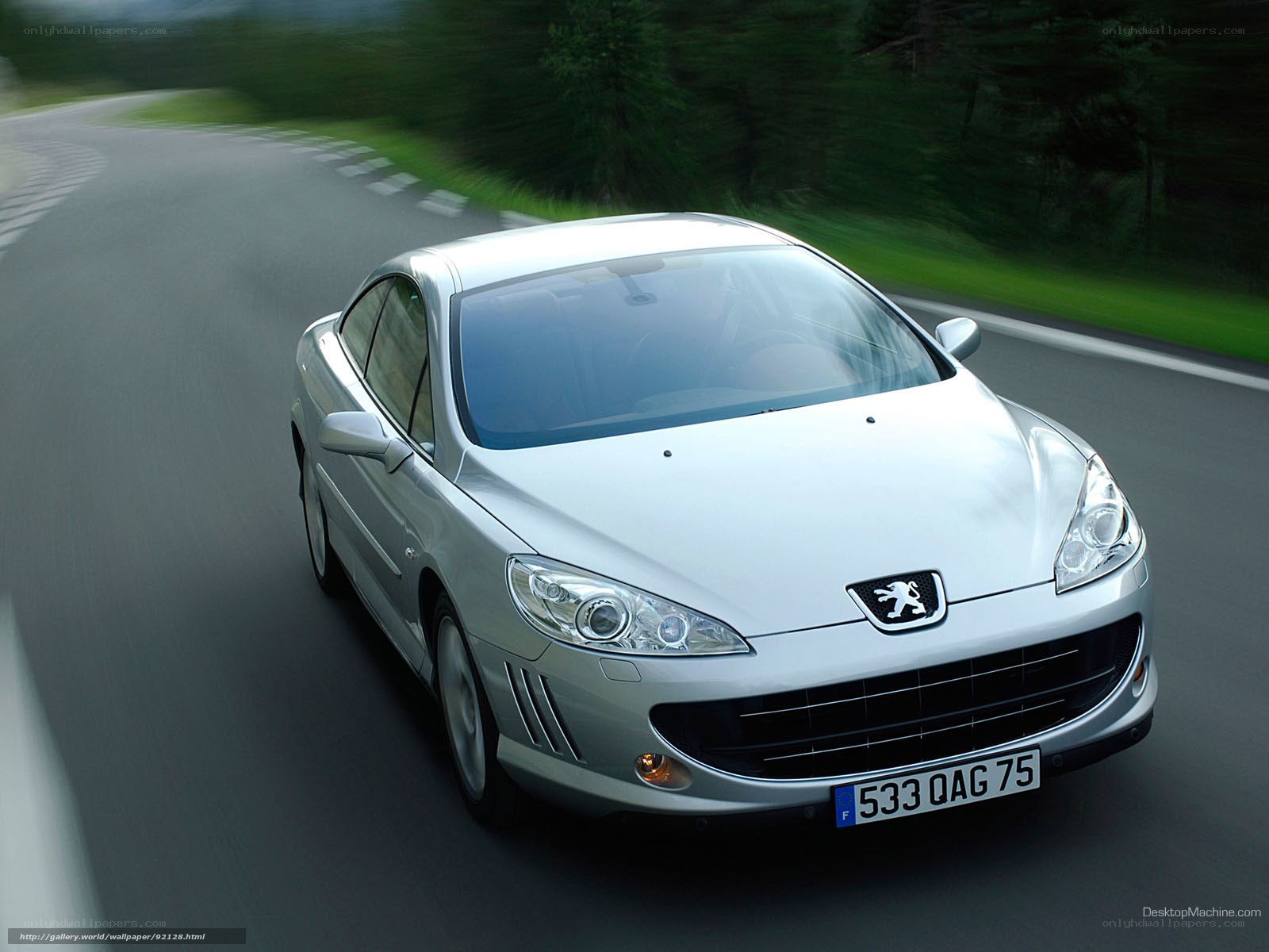 silver peugeot 407 driving on road