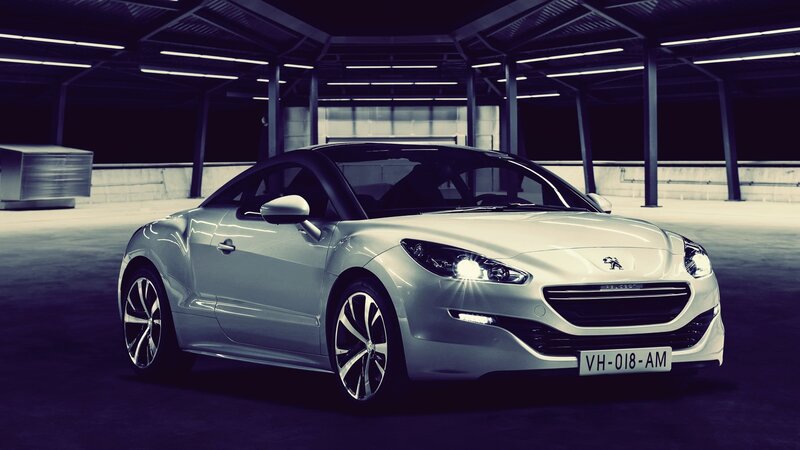 silver peugeot car in garage