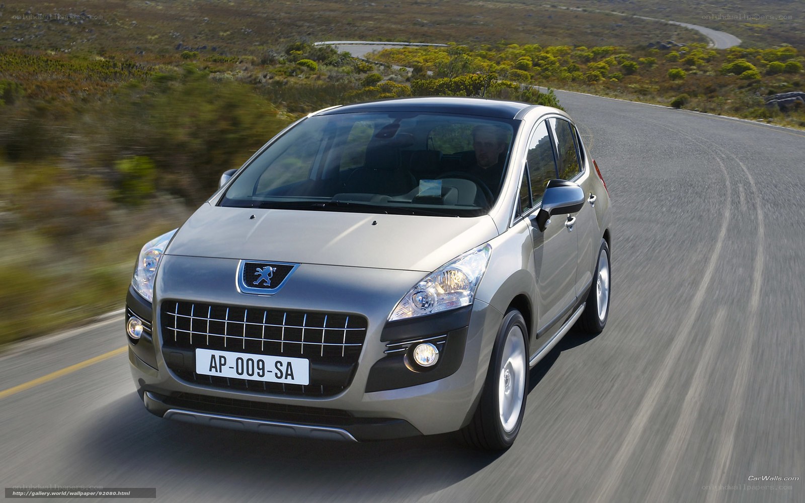 silver peugeot driving on road