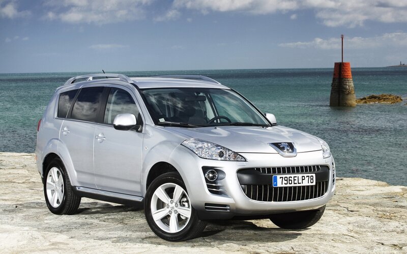 Silver Peugeot SUV by the sea