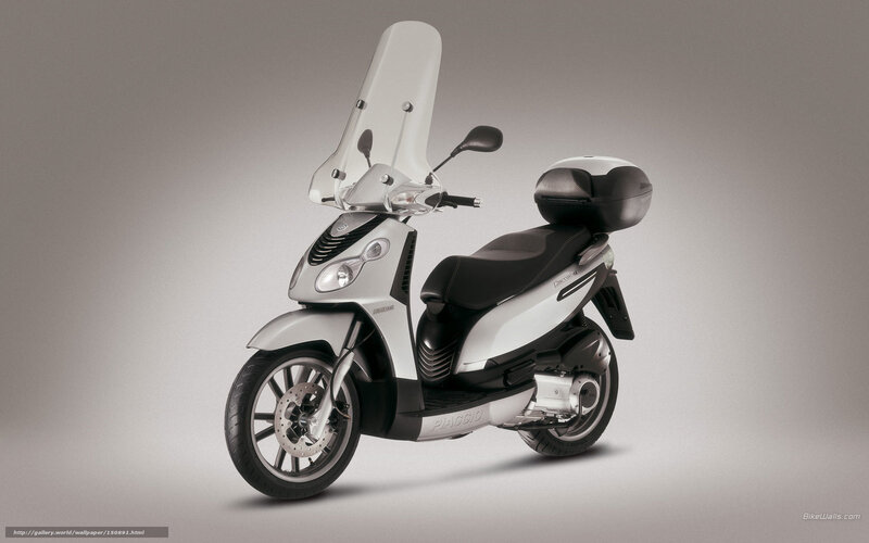 Silver Piaggio scooter with windscreen