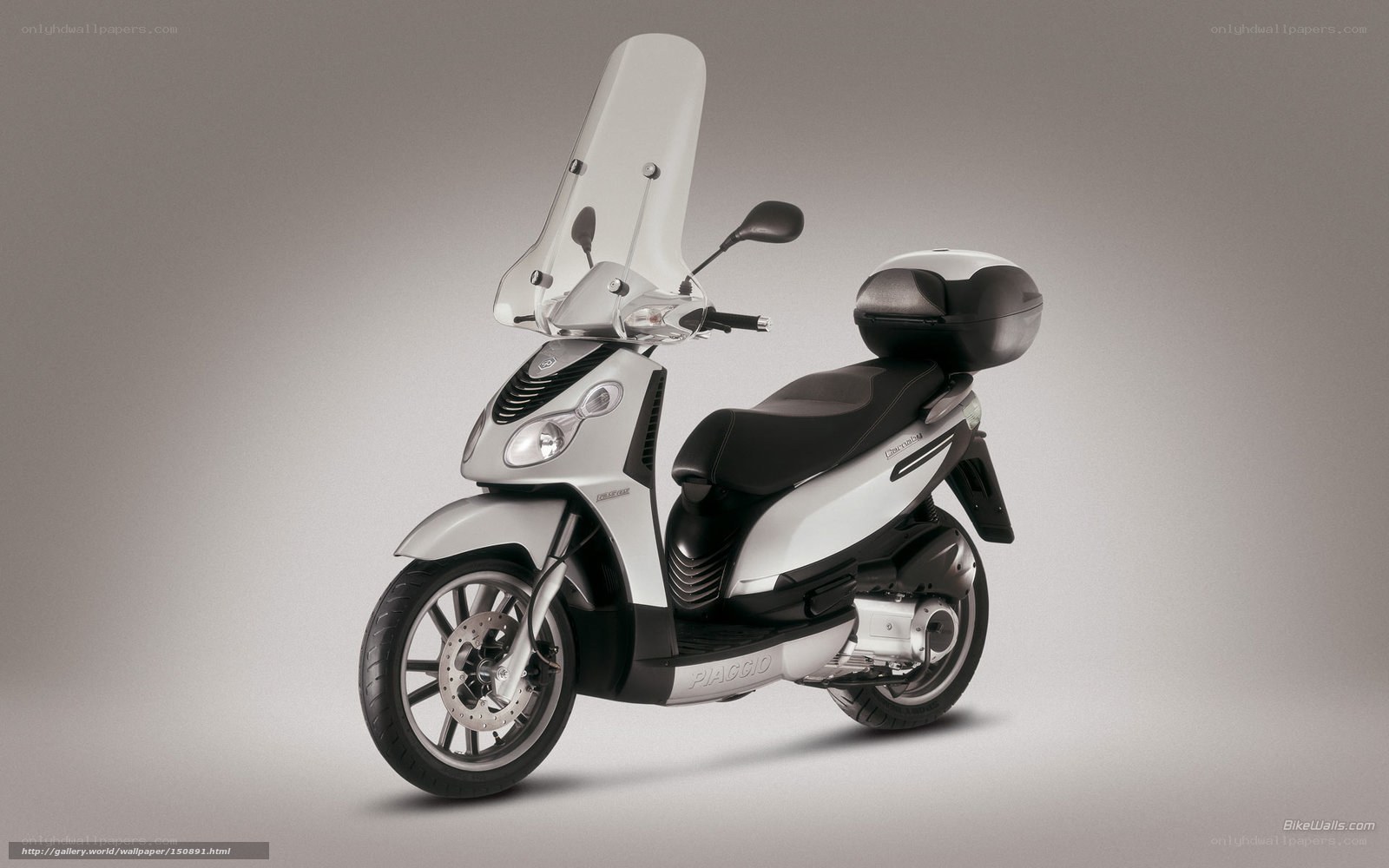 Silver Piaggio scooter with windscreen