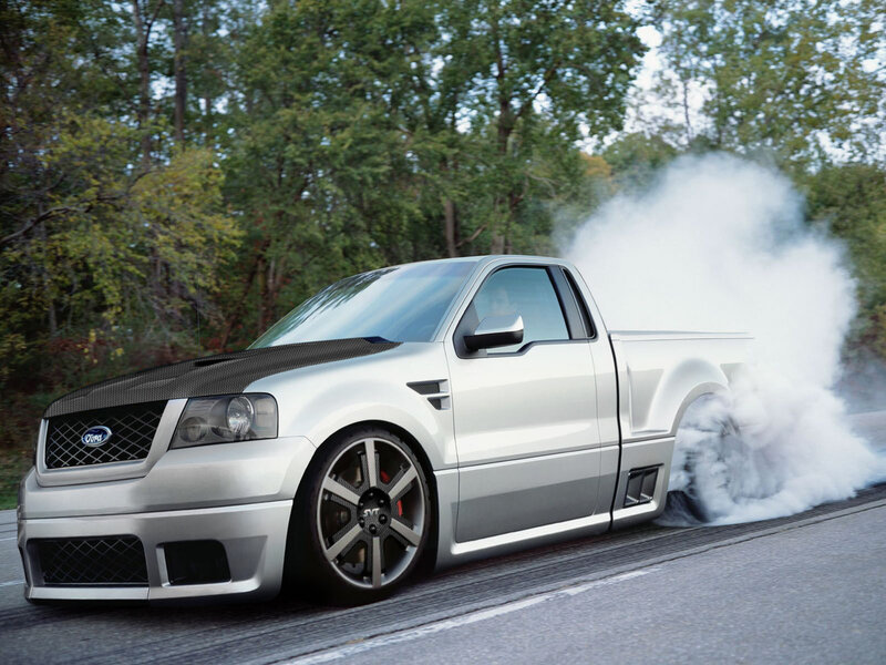 silver pickup truck burnout